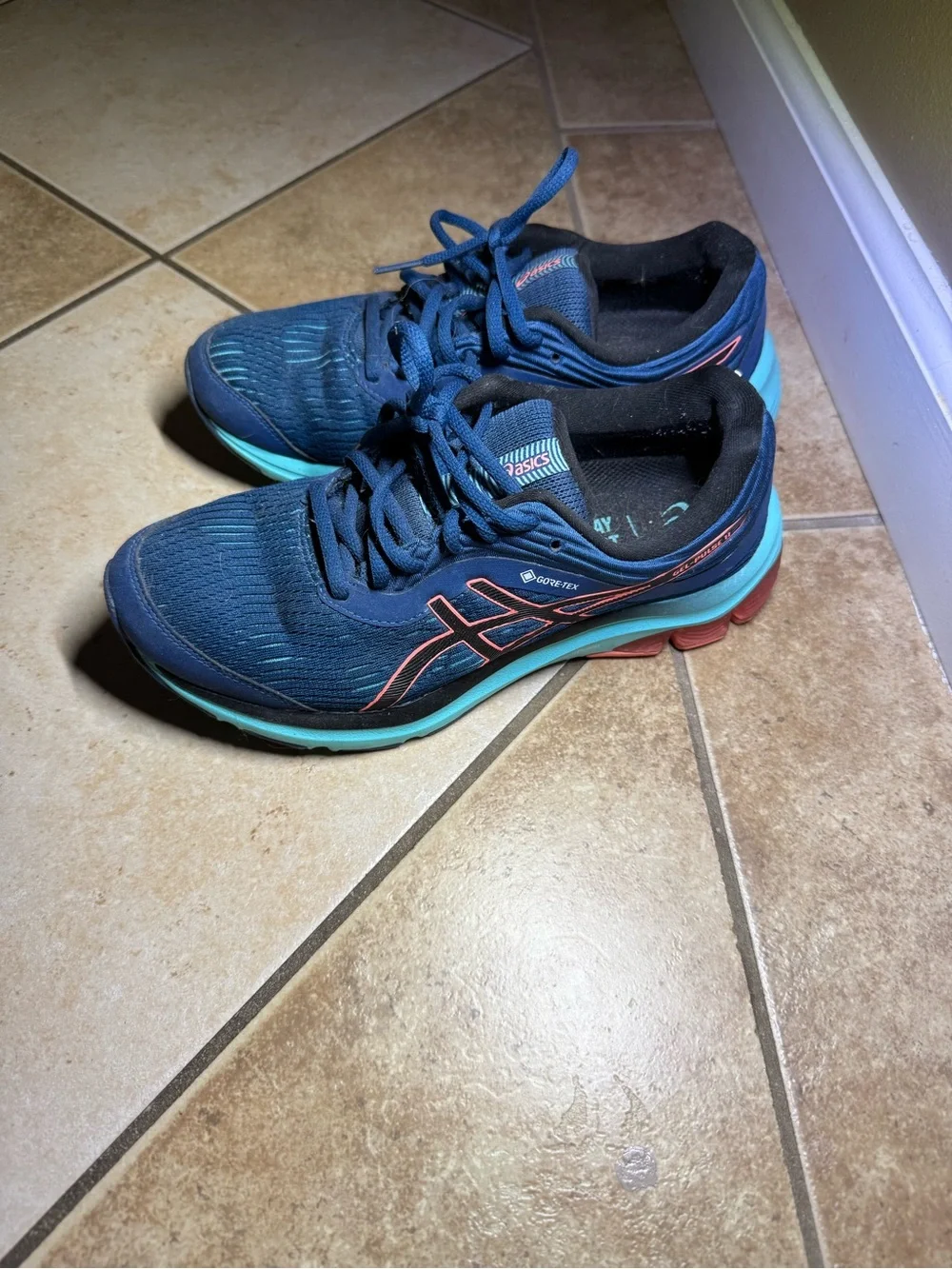 Asics Navy Running Shoes with Teal Soles and Coral Accents